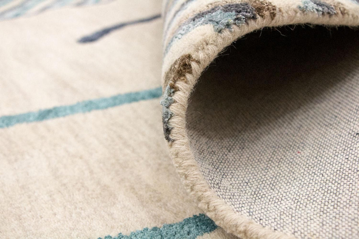 Designerski dywan - 243 x 153 cm - beżowy