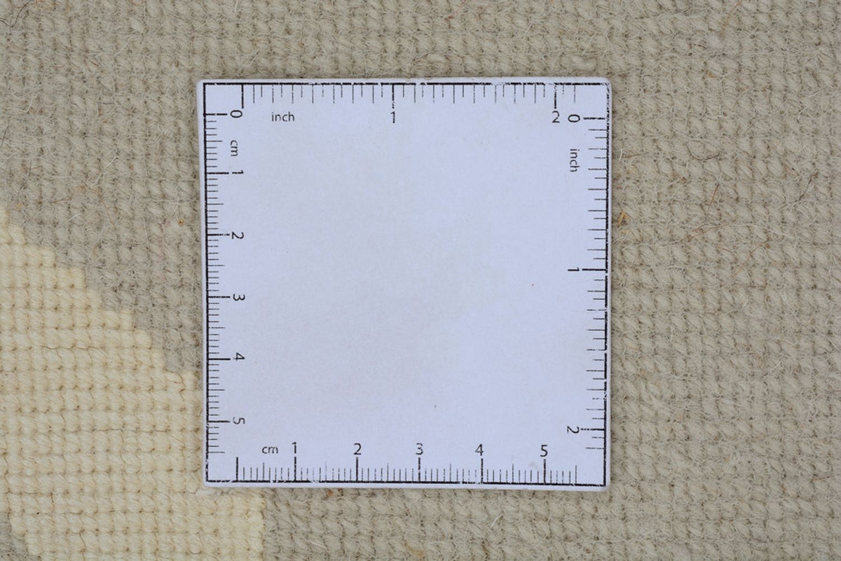 Designerski dywan - 236 x 174 cm - beżowy