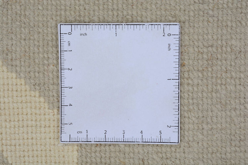 Designerski dywan - 236 x 174 cm - beżowy