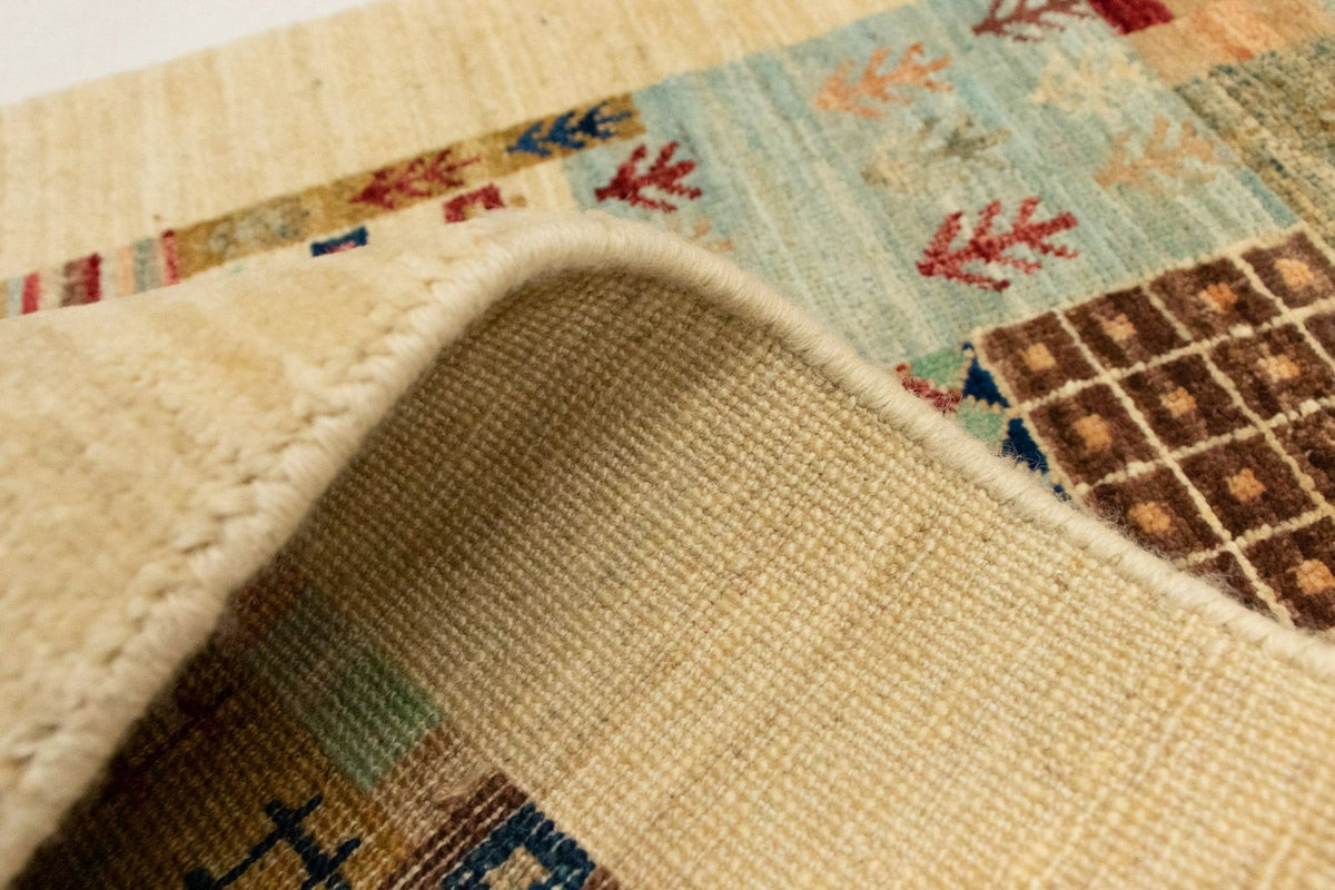 Designerski dywan - 137 x 70 cm - beżowy